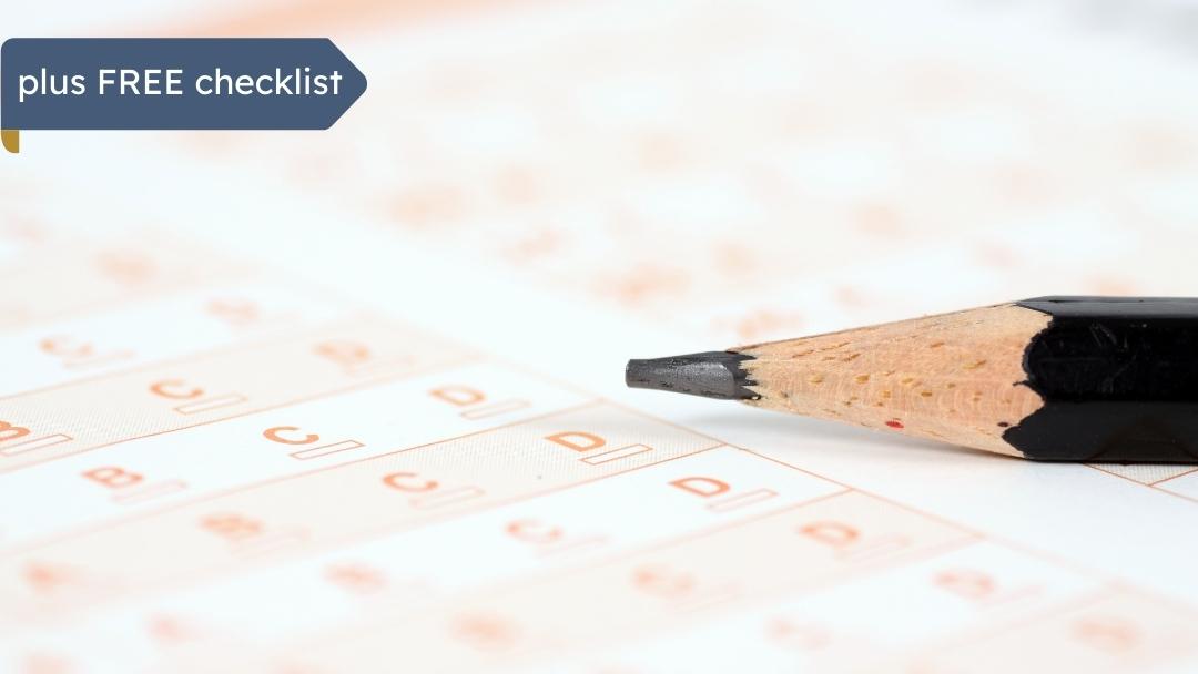 close up of a multiple choice exam answer sheet with a sharpened pencil on top