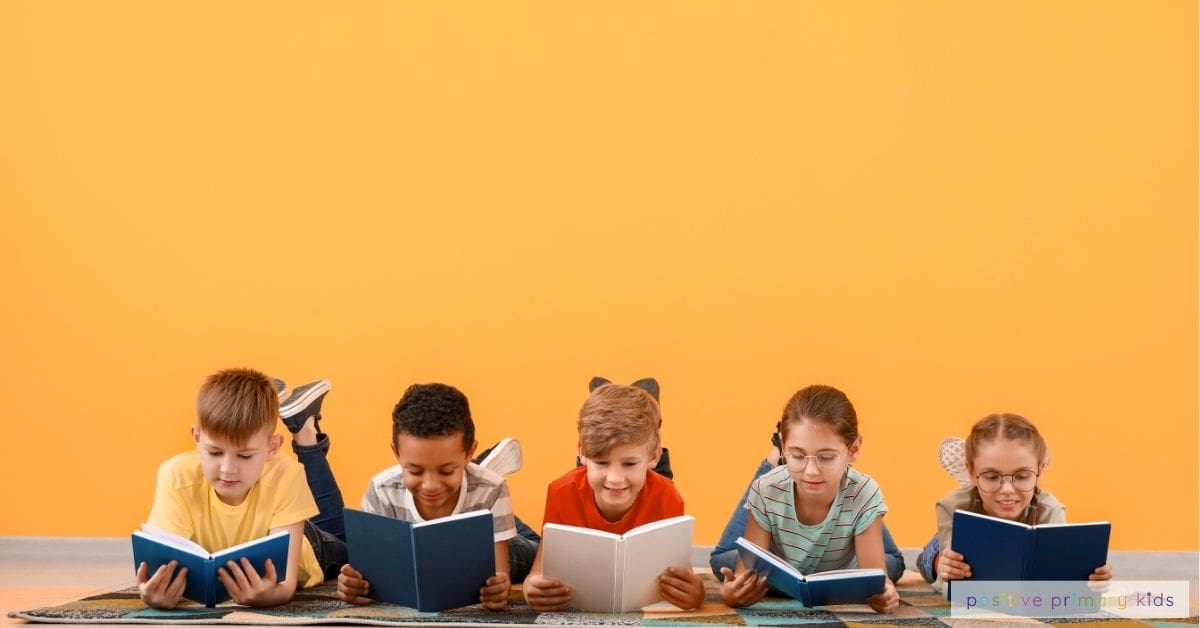 a group of children happily lying on the floor in a row reading books